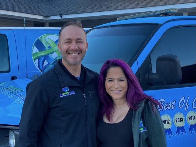 Dan and Angela Udy in front of an A-1 van